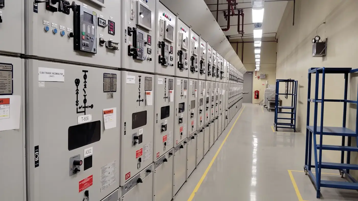Line-up of medium-voltage switchgear with protection relays in an electrical room